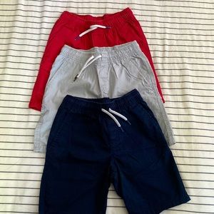 Cat & Jack woven pull-on shorts. Size: S (6/7). Color: Navy, red, light gray.